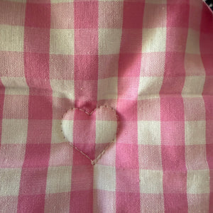 Pink gingham fabric with embroidered heart