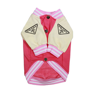 Pink and beige dog coat with Prada logo on a white background