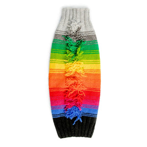 Colorful knitted dog sweater with a rainbow pattern on a white background