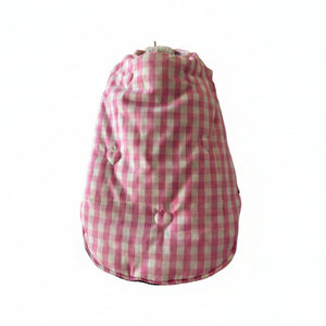 Pink and white gingham reversible puffer dog coat on a white background
