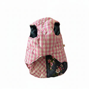Pink gingham with heart embroidery on the second side of reversible dog puffer jacket shwon here on white background