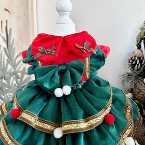 Designer Handmade Green Christmas Tree Dog Dress has gold ribbon and red and white pompom ornaments