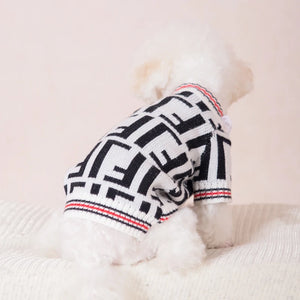 Fendi designer-inspired dog sweater cardigan is white with black and red stripes on the sleeves and trim and large F letters print throughout