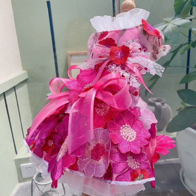 Our designer handmade Hot Pink Daisy Dog Party Dress is exquisitely crafted with the finest details, including large embroidered Gerbera daisy flowers, tulle, ribbon bow and lace