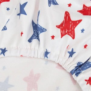 White dog pjs with red and blue star pattern