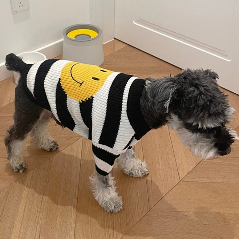 Featuring black and white horizontal stripes and a large yellow happy face, this dog sweater is perfect for small to medium dogs.