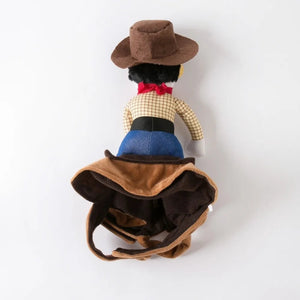 A plush toy of a cowboy character shown from the back, wearing a brown hat, beige checkered shirt, red bow tie, blue pants, and a brown vest, set against a plain white background.