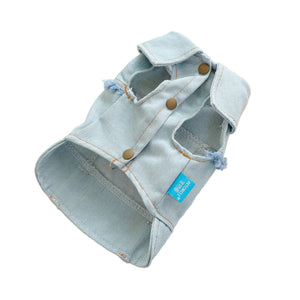 Denim dog jacket has 3 snap buttons on underbelly