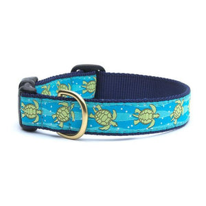 Up Country Sea Turtle Dog Collar features green sea turtles swimming in a blue of ocean currents, with navy trim.