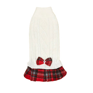 White sweater with a red plaid skirt and bow