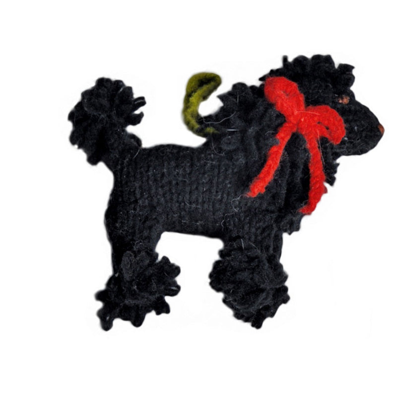 Black poodle with a red bow on a white background