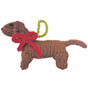 Knitted Dachschund ornament
with a red bow on a white background