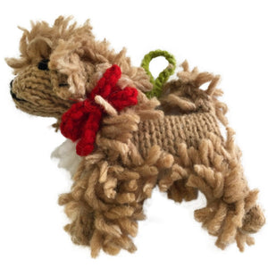 Knitted Dooole ornament with a red bow on a white background