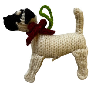 Knitted Great Dane ornament with a red scarf and green tag on a white background