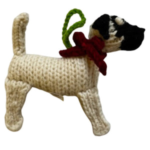 Knitted Great Dane ornament with a red scarf and green tag on a white background
