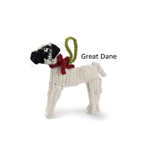 Knitted Great Dane dog toy with a red bow on a white background