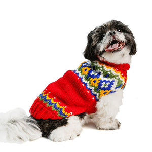 Shih Tsu wearing a colorful sweater on a white background
