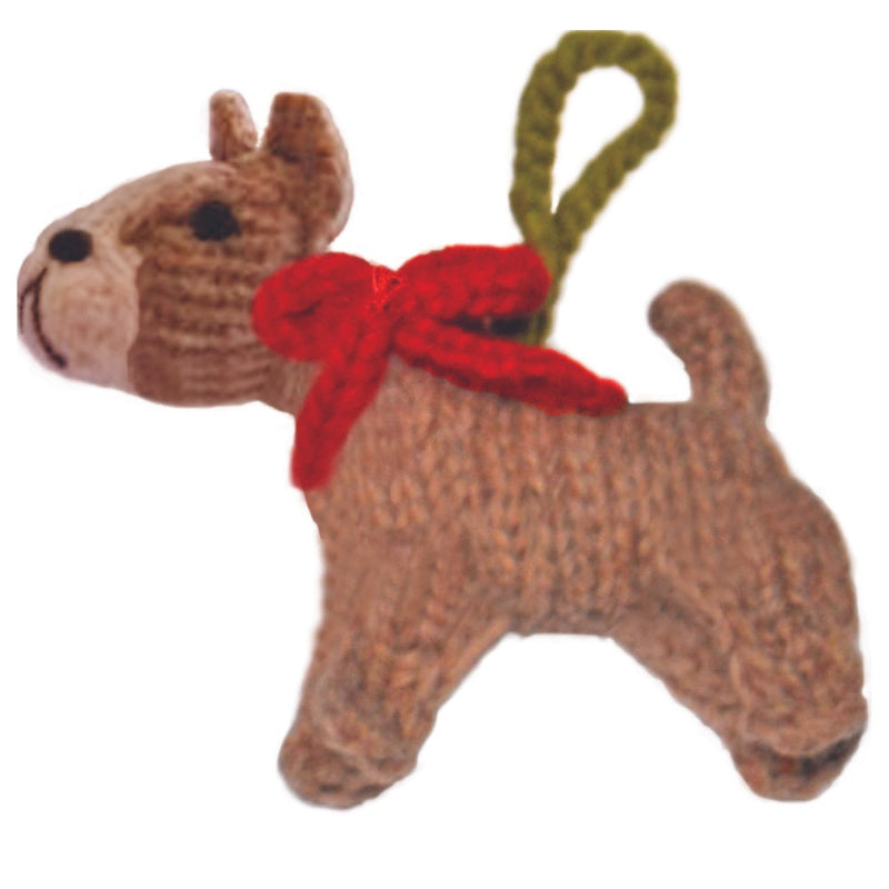 Dog-shaped toy with a red bow on a white background