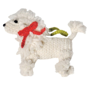 Knitted Poodle ornament with a red bow and green tag on a white background