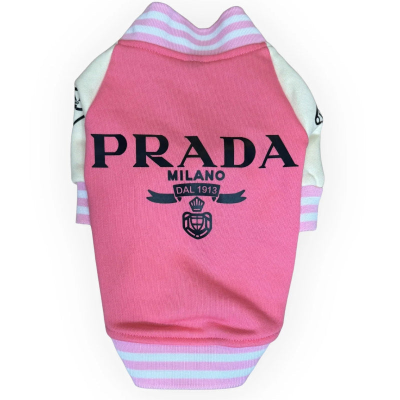 Pink Prada varsity dog jacket with white sleeves pink and white striped trim and black designer-inspired graphic