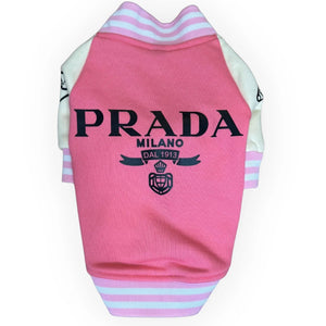 Pink Prada varsity dog jacket with white sleeves pink and white striped trim and black designer-inspired graphic