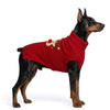 A black and tan Doberman dog wearing a red knit turtleneck reindeer sweater. 