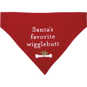 Santa's Favorite Wigglebutt Reversible Christmas Dog Bandana in red linen with white lettering and an embroidered ribbon-tied bone
