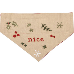 This cream Christmas small reversible dog collar bandana features "Nice" sentiment with holiday botanical designs on this side.