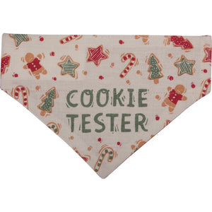 Christmas Reversible Dog Bandana has "Cookie Tester" sentiment with cookie designs on one side on a cream background.