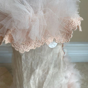 This handmade “Baby Doll” pink dog party dress is exquisitely crafted with shimmering pink circles, dainty pink ruffle tulle and lace.