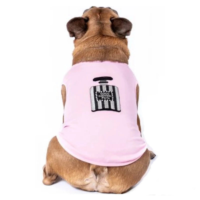 Made of 100% Pima cotton, this designer-inspired embroidered dog T-shirt by Aventura Pups features a Chewnel black-and-silver perfume bottle on a light pink T-shirt