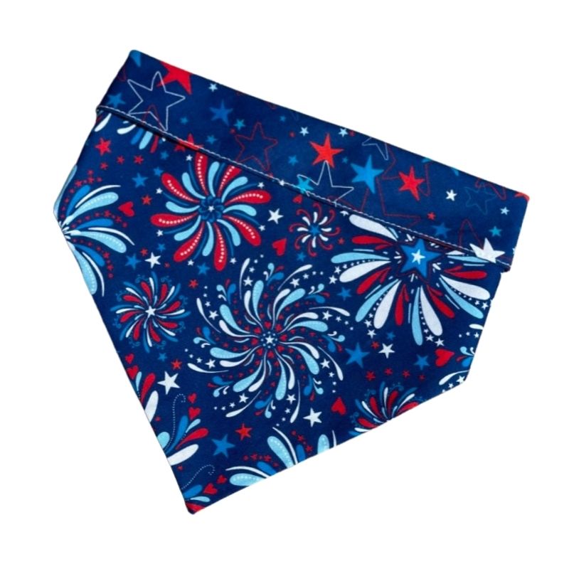 Handmade in the USA by Chloe & Max, this Fireworks Bandana features Americana red, white and blue, with stars trim and backing.
