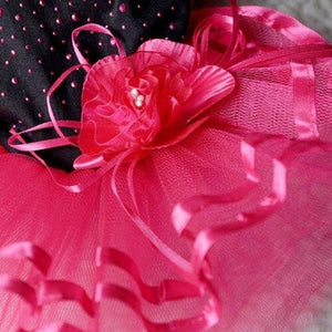 This Hot Pink & Black Flamenco Dog Party Dress is adorned with a handmade rose flower at the waist and bling pink beading on the bodice.