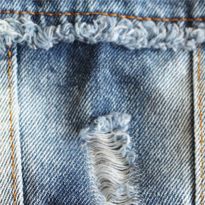 Frayed Denim Dog Jacket has faded patches and designed tears.