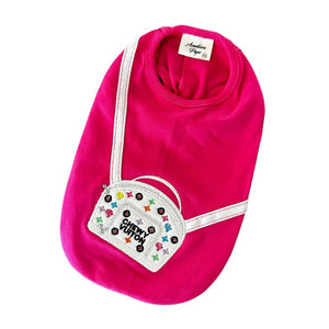 Made of 100% Pima cotton, this designer-inspired embroidered dog T-shirt by Aventura Pups features a Chewy Vuitton white handbag on a hot pink T-shirt.