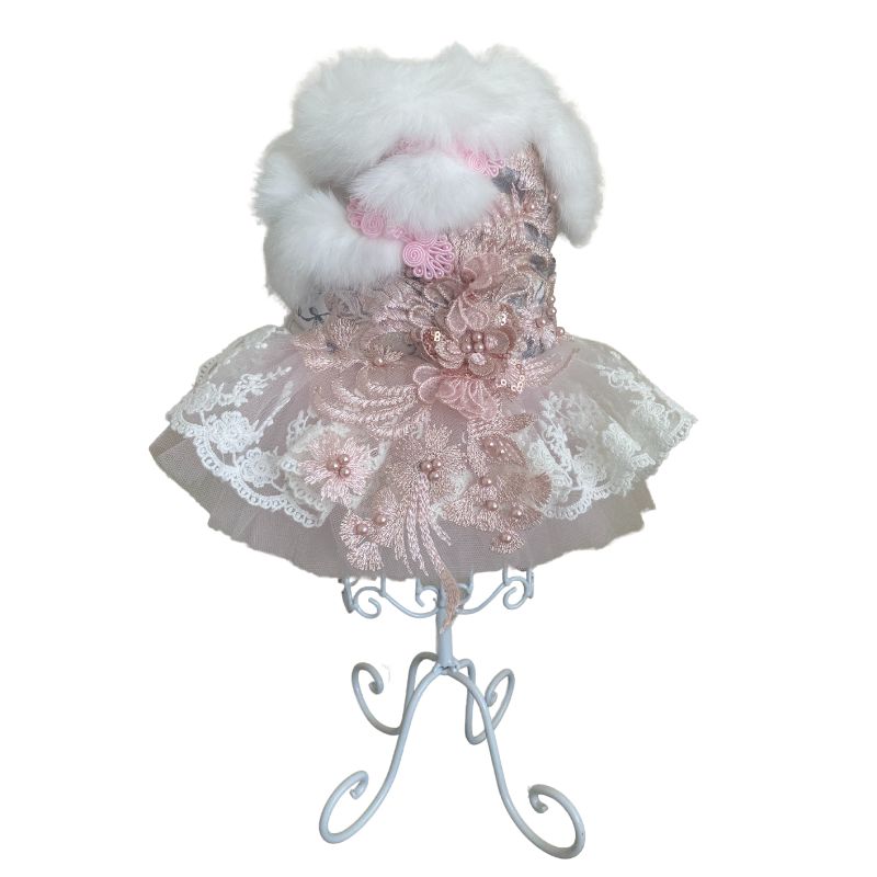 Designed for Posh Dog Life, our handmade Juliette Dog Party Dress is exquisitely crafted for your winter princess with the finest details, including fur, feathers, flowers, faux pearls, embroidered floral lace and a tulle skirt.