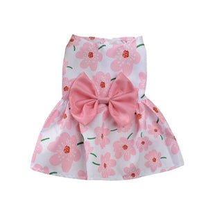 Adorned with a pink bow, this lightweight cotton Pink Flower Dog Dress from our Spring/Summer collection fits small dogs