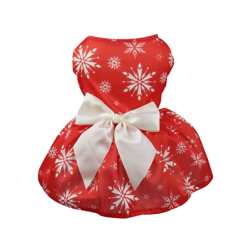 Perfect for holiday parties, this red Christmas Snowflake Dog Party Dress features white snowflakes and a white satin bow for small to medium dogs.