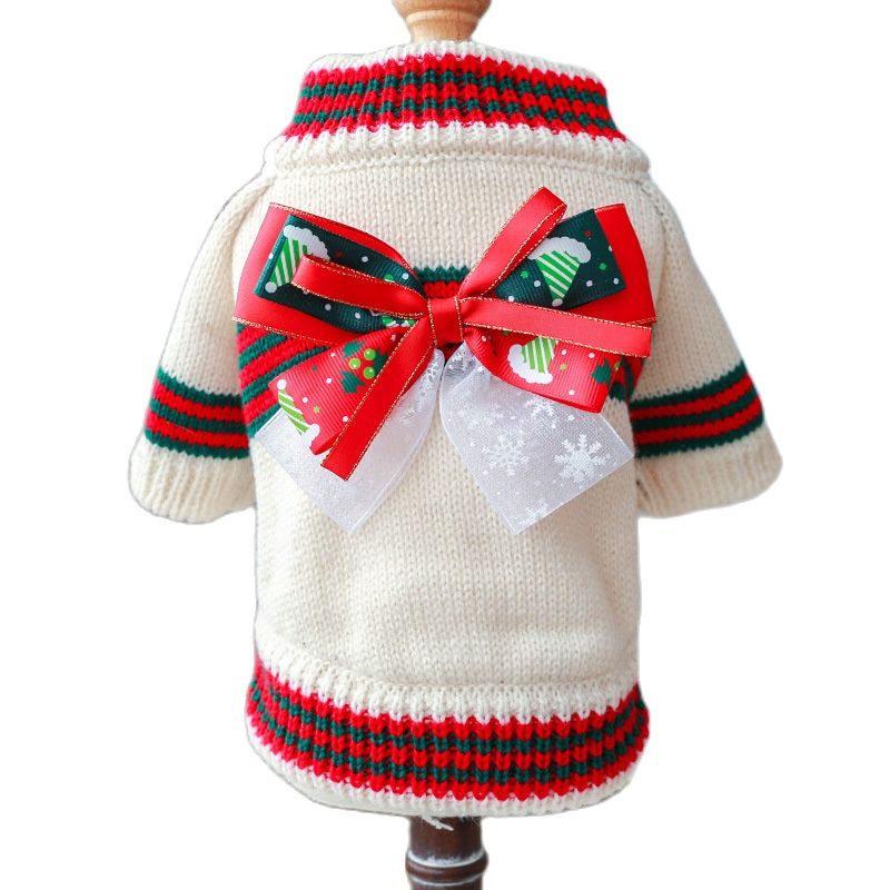 Absolutely adorable, this festive Christmas Bow Turtleneck Dog Sweater is available in three colors: White, Red or Green for small to medium dogs. Here pictured in white body. Neck and sleeves in red/green stripes. Red and white Christmas bow on center of back.