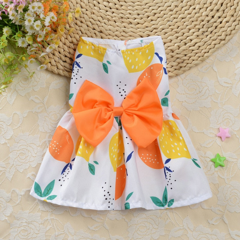 Adorned with an orange bow, this lightweight cotton Orange and Lemons Dog Dress from our Spring/Summer collection fits small dogs,