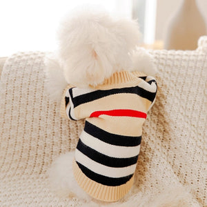 This classy Striped Button-Down Dog Cardigan is cream, with black, cream, white and red horizontal stripes.
