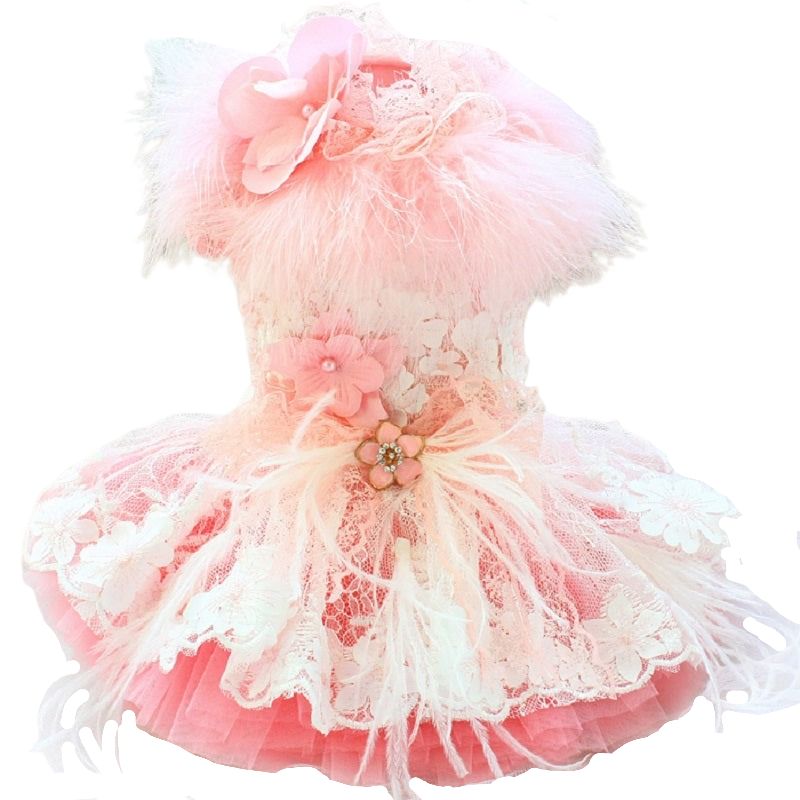 Our handmade Sophia Dog Party Dress is exquisitely crafted with the finest details, including feathers, embroidered floral lace, faux-pearl applique flowers and a tulle skirt.