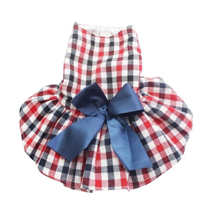 Delight your darling with this Pretty Plaid Dog Party Dress, adorned with a large navy satin bow and red tulle tutu underskirt.
