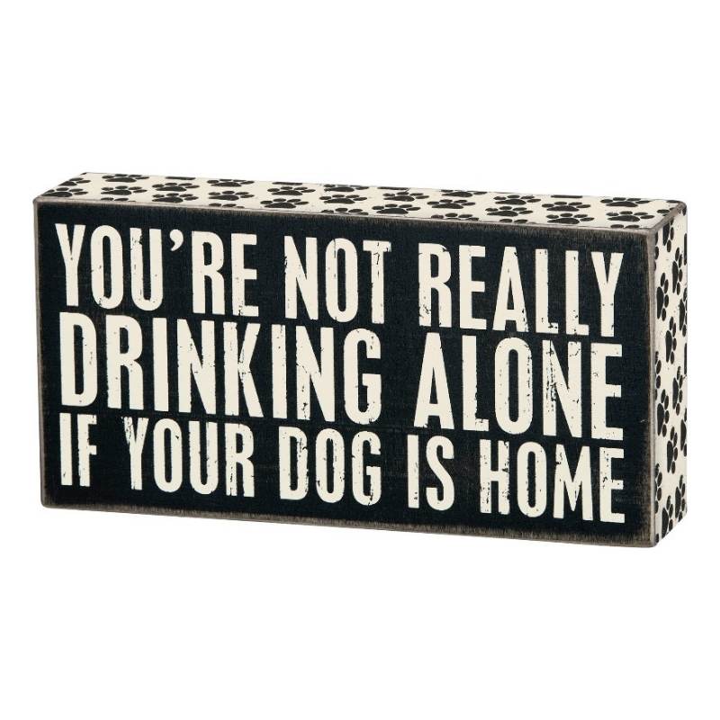 Box Sign - You're Not Really Drinking Alone white letters on black background with black paw prints frame on white