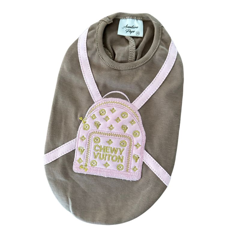 Made of 100% Pima cotton, this designer-inspired embroidered dog T-shirt by Aventura Pups features a parody Chewy Vuitton pink backpack on a mocha T-shirt.