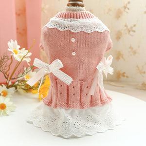 Pink Sweet Lace Dog Sweater Dress is adorned with bows, faux pearls and lace.
