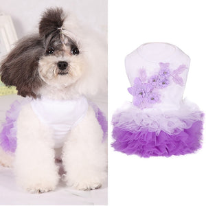 White Floral Bubble Tutu Dog Party Dress features a purple skirt and purple flower applique on the bodice.