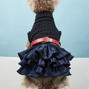 This Chic Turtleneck Sweater Dog Dress features a knit bodice, belt and satin tutu.